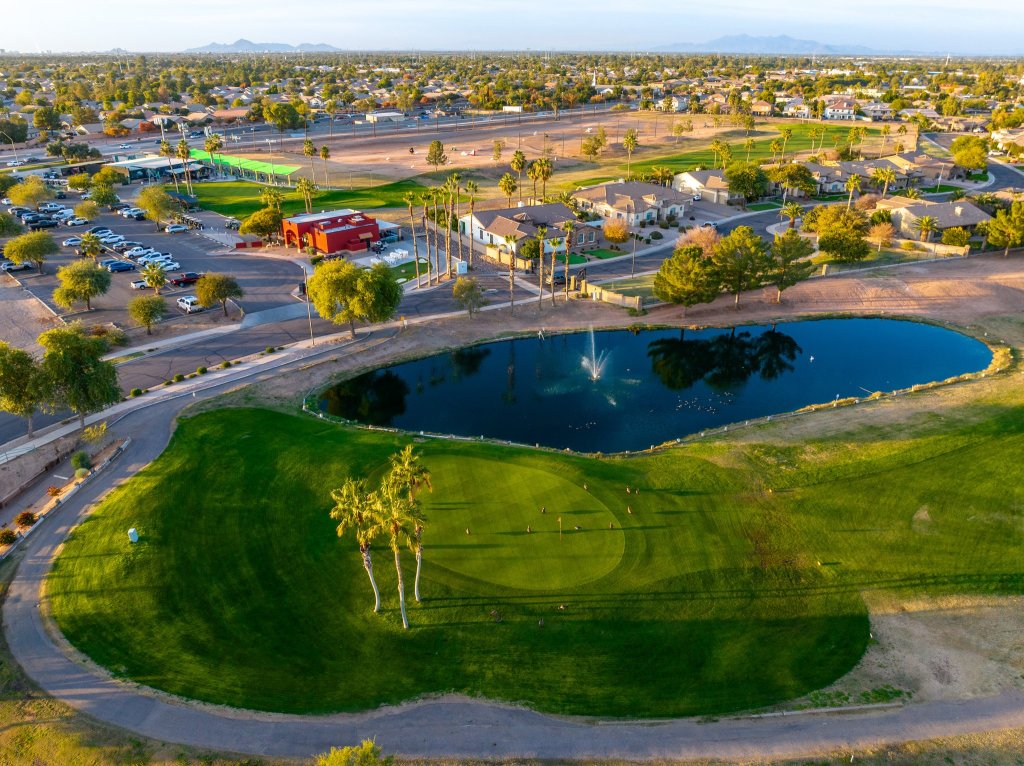 Aerial view of golf course and pond 